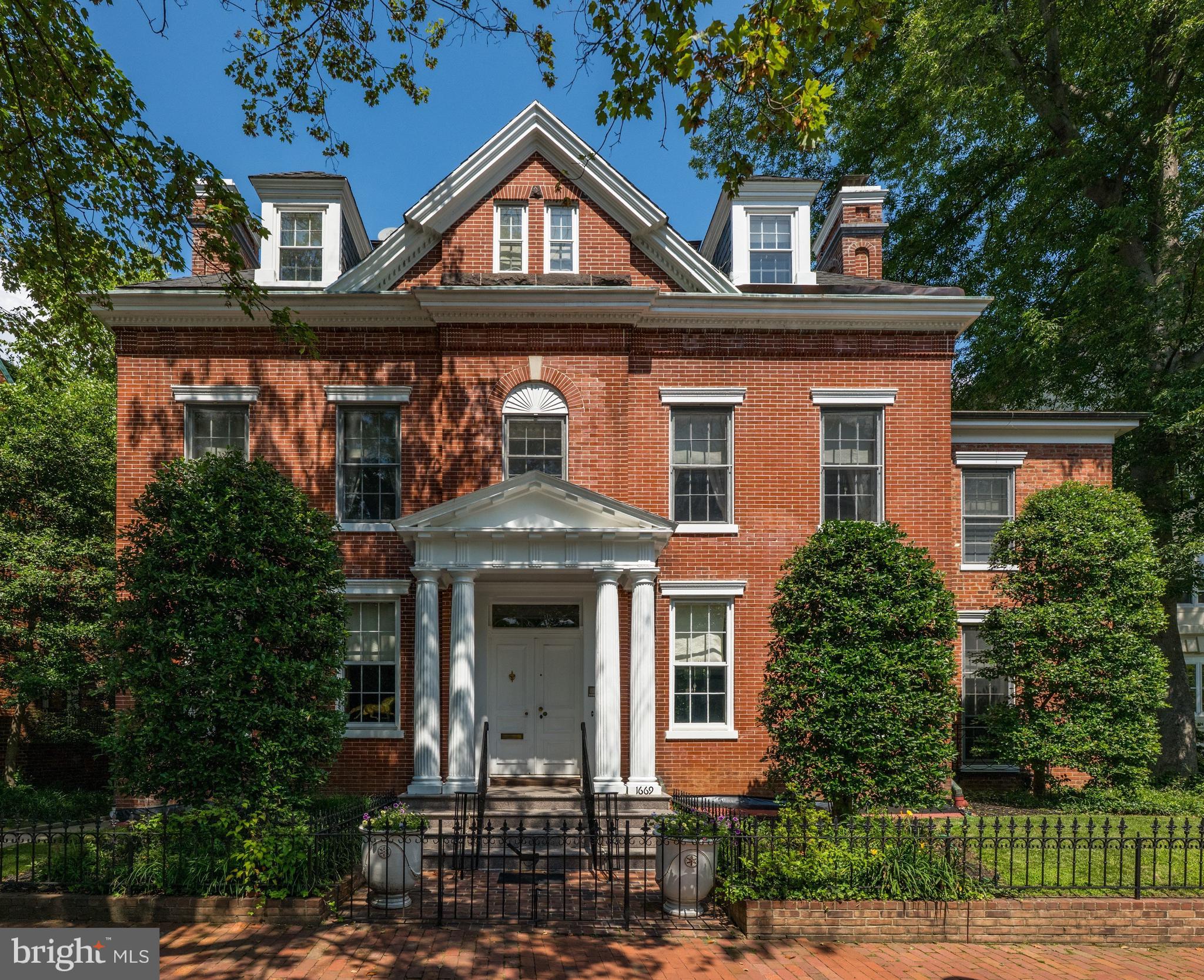 1669 31st Street Northwest Washington, DC 20007 - Photo 2 of 15 a front view of a house with a yard