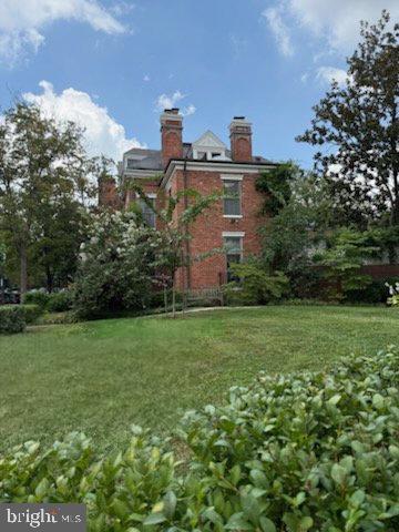 1669 31st Street Northwest Washington, DC 20007 - Photo 8 of 15 a view of a green field with some trees in the background