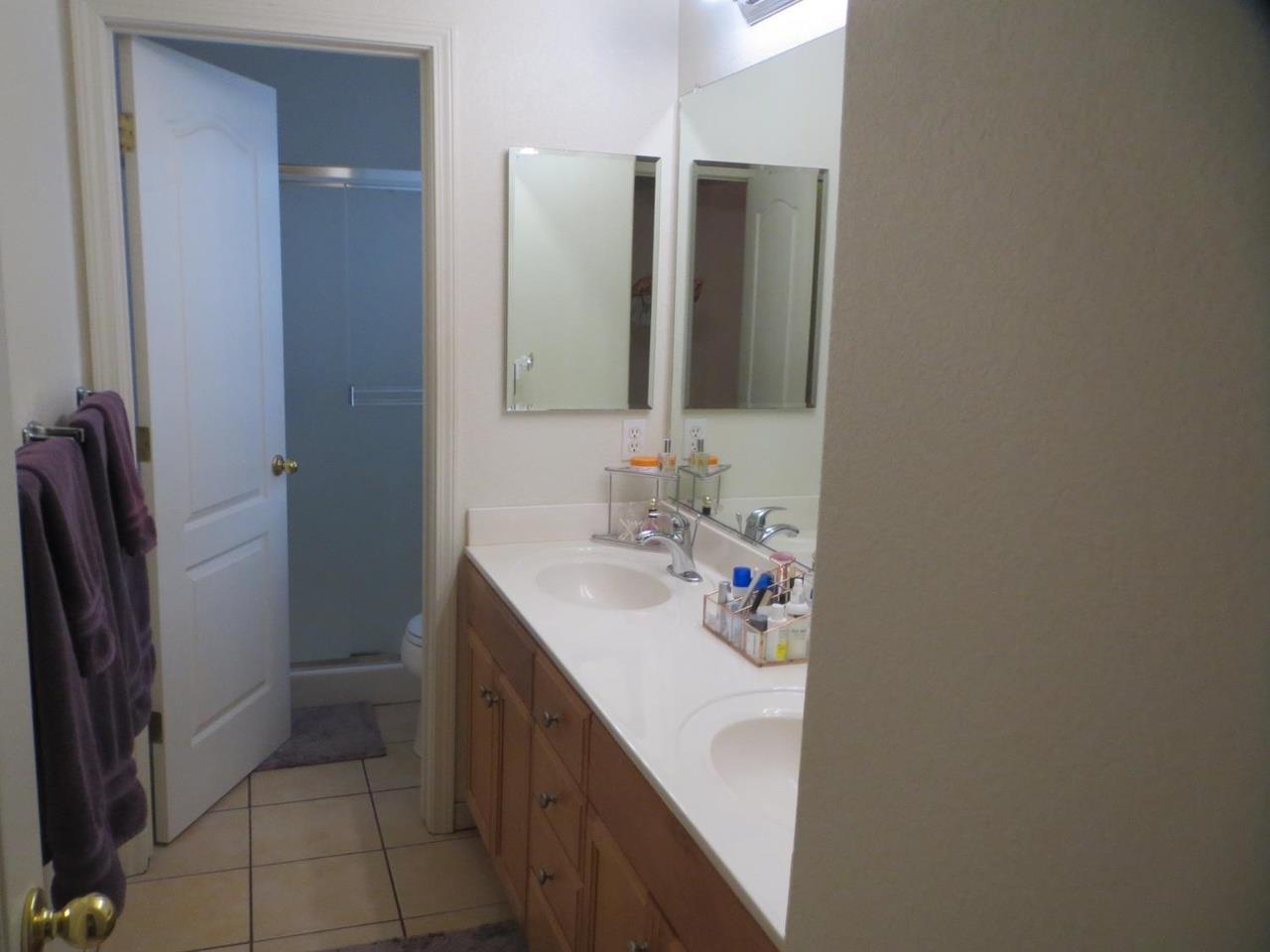 4125 Pathway Lane Turlock, CA 95382 - Photo 11 of 15 a bathroom with a sink and a mirror