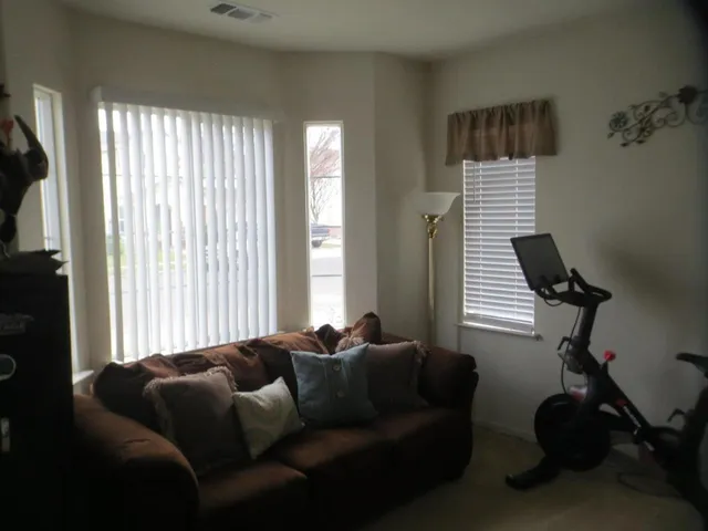 a living room with furniture and a window