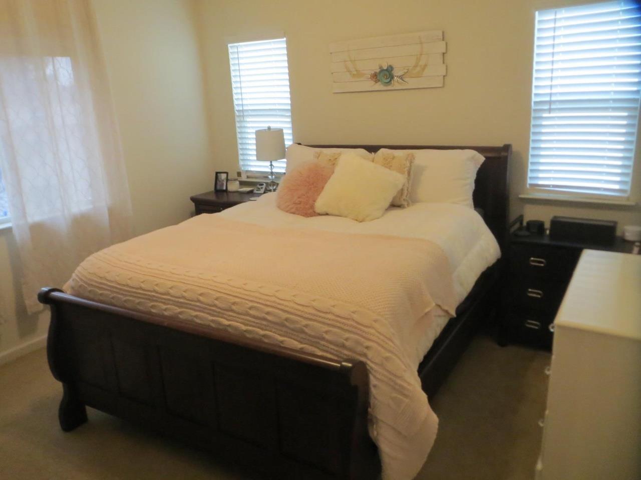 4125 Pathway Lane Turlock, CA 95382 - Photo 7 of 15 a bedroom with a bed and window