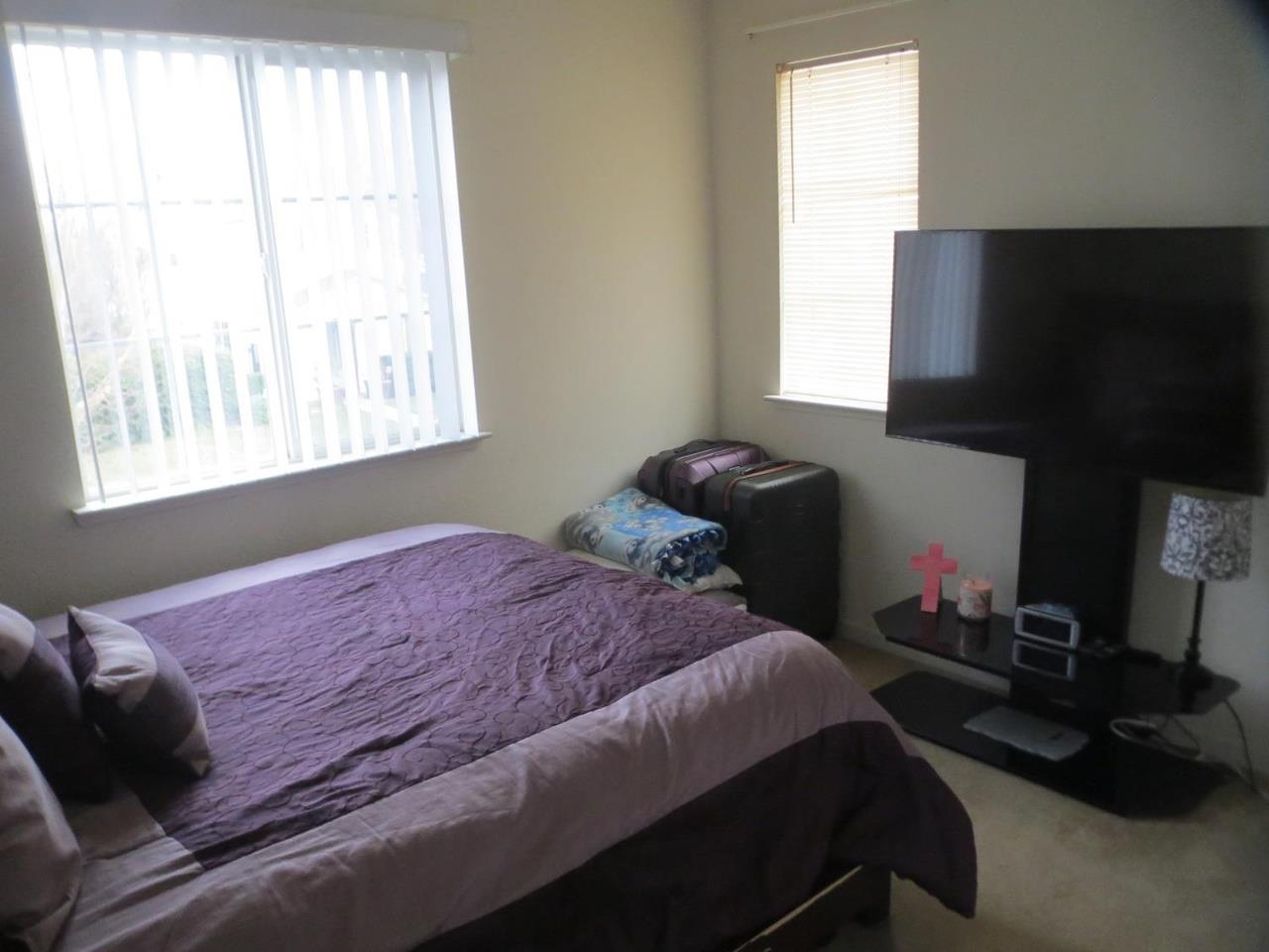 4125 Pathway Lane Turlock, CA 95382 - Photo 8 of 15 a bedroom with a bed and a window