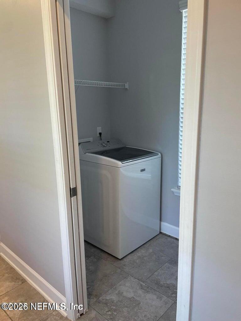 142 Jackrabbit Trail Ponte Vedra, FL 32081 - Photo 17 of 77 a utility room with dryer and washer