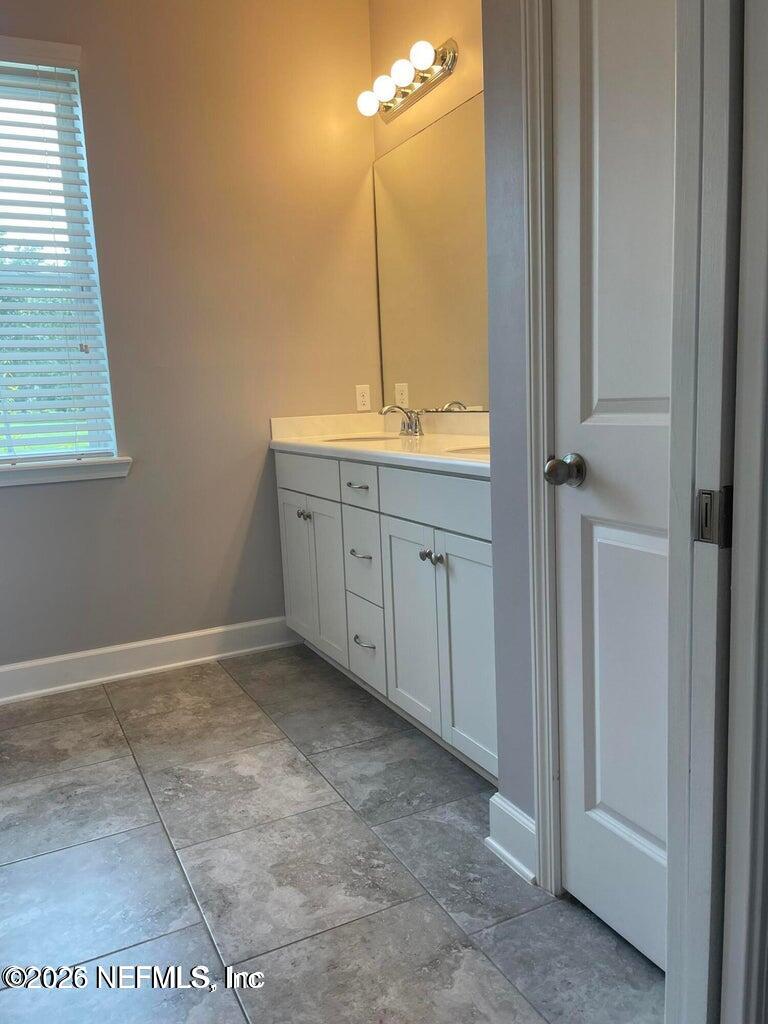 142 Jackrabbit Trail Ponte Vedra, FL 32081 - Photo 23 of 77 a bathroom with a sink and a mirror
