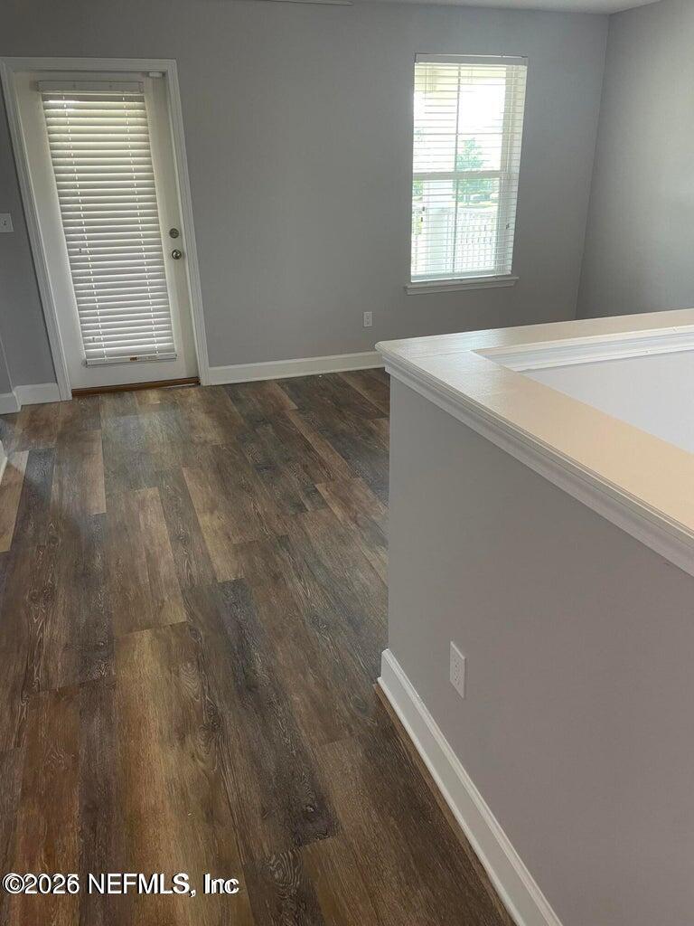 142 Jackrabbit Trail Ponte Vedra, FL 32081 - Photo 31 of 77 an empty room with wooden floor and windows
