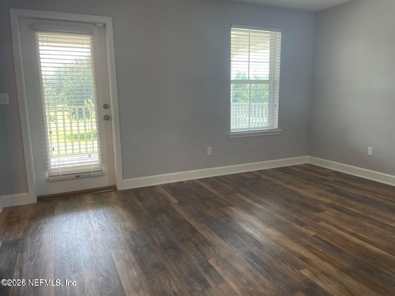142 Jackrabbit Trail Ponte Vedra, FL 32081 - Photo 33 of 77 an empty room with wooden floor and windows