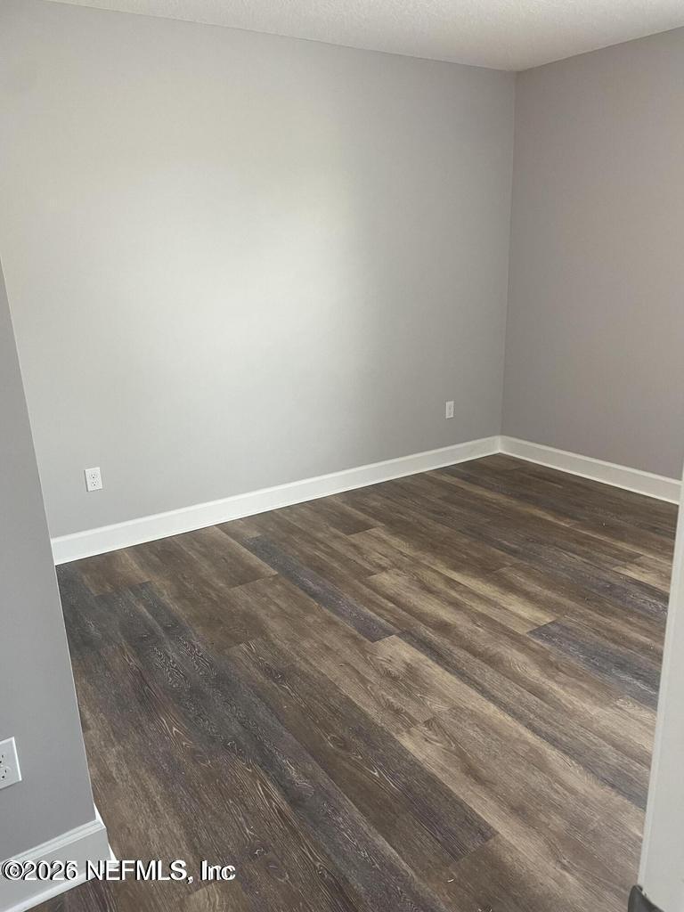 142 Jackrabbit Trail Ponte Vedra, FL 32081 - Photo 40 of 77 a view of an empty room with wooden floor