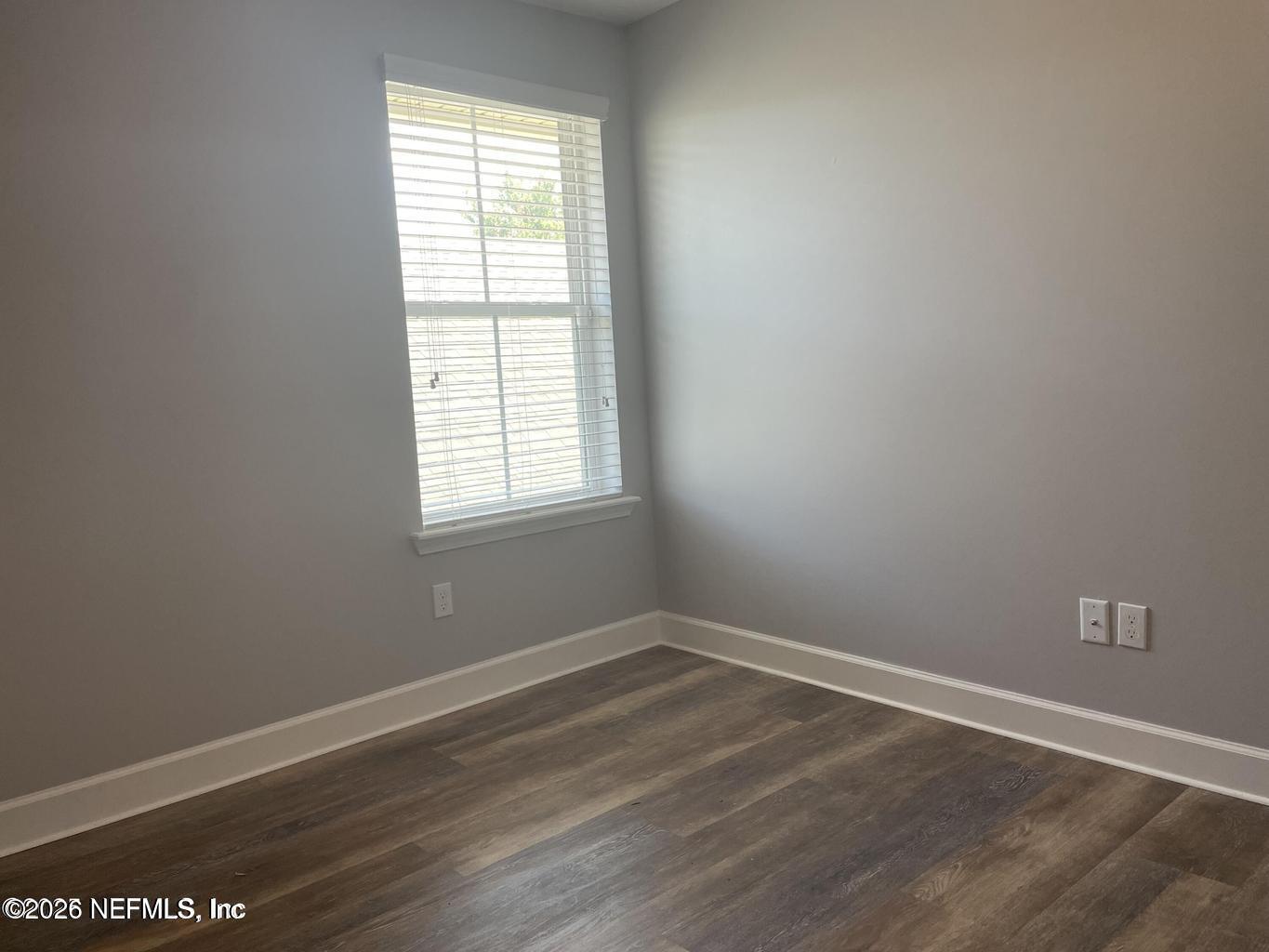 142 Jackrabbit Trail Ponte Vedra, FL 32081 - Photo 46 of 77 an empty room with wooden floor and windows