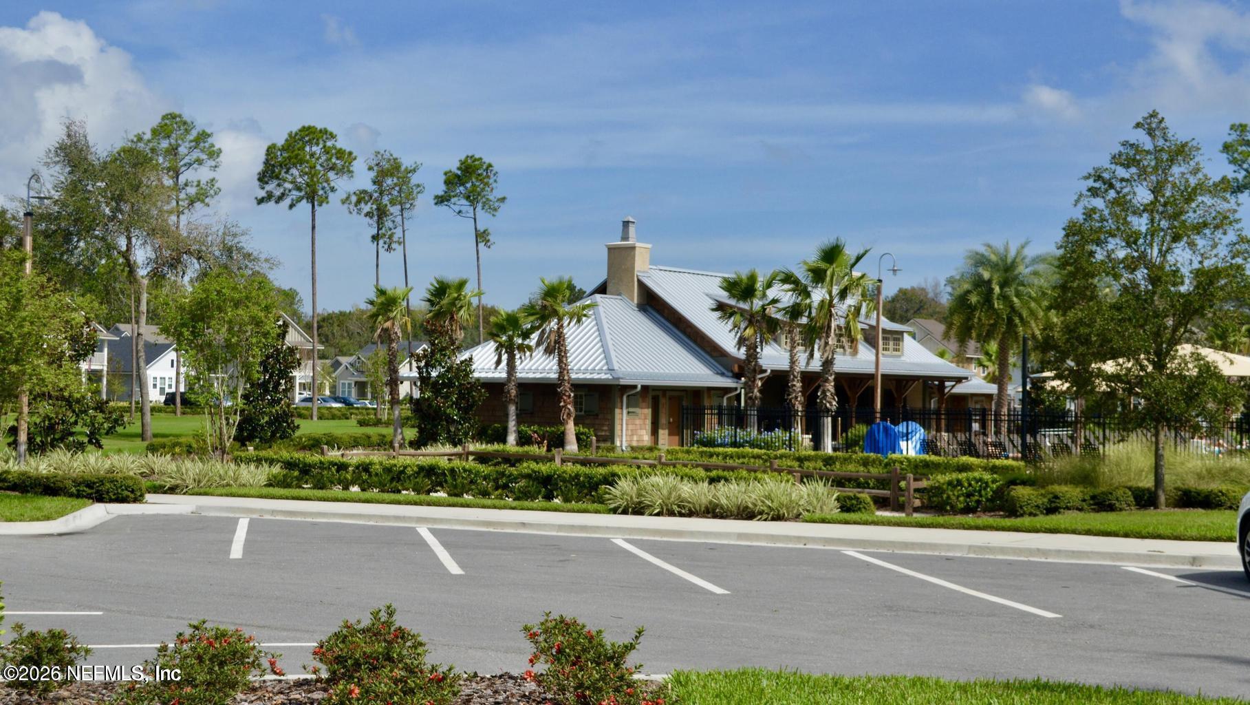 142 Jackrabbit Trail Ponte Vedra, FL 32081 - Photo 54 of 77 a front view of a house with a yard and outdoor seating