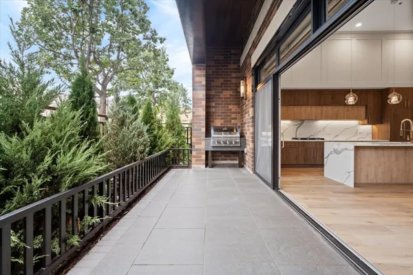 a view of a balcony with chairs
