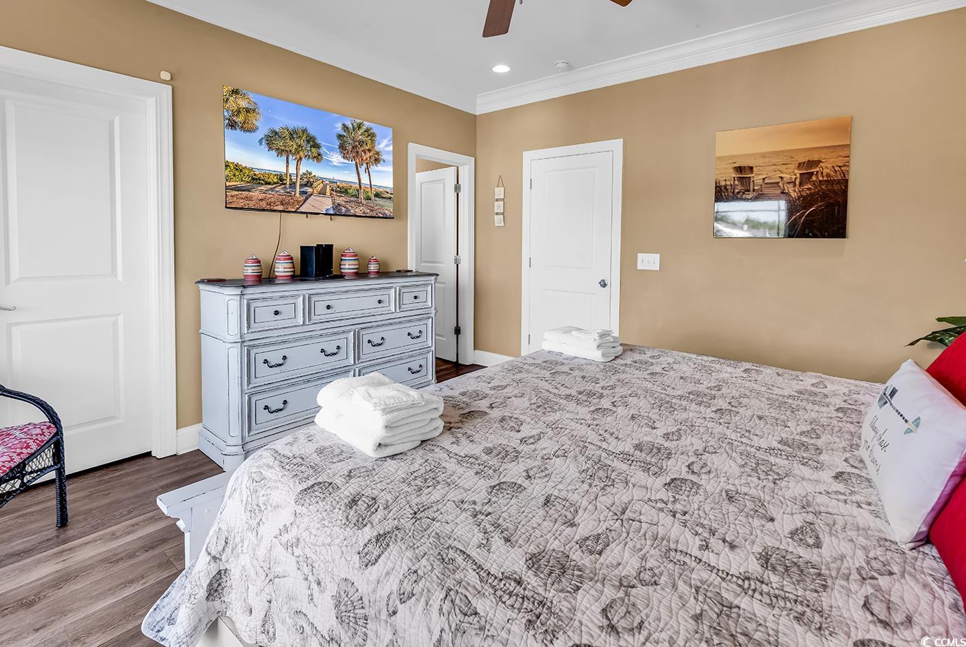 124 B Vista Drive Murrells Inlet, SC 29576 - Photo 16 of 38 Bedroom with ornamental molding, dark wood-type flooring, a ceiling fan, and recessed lighting