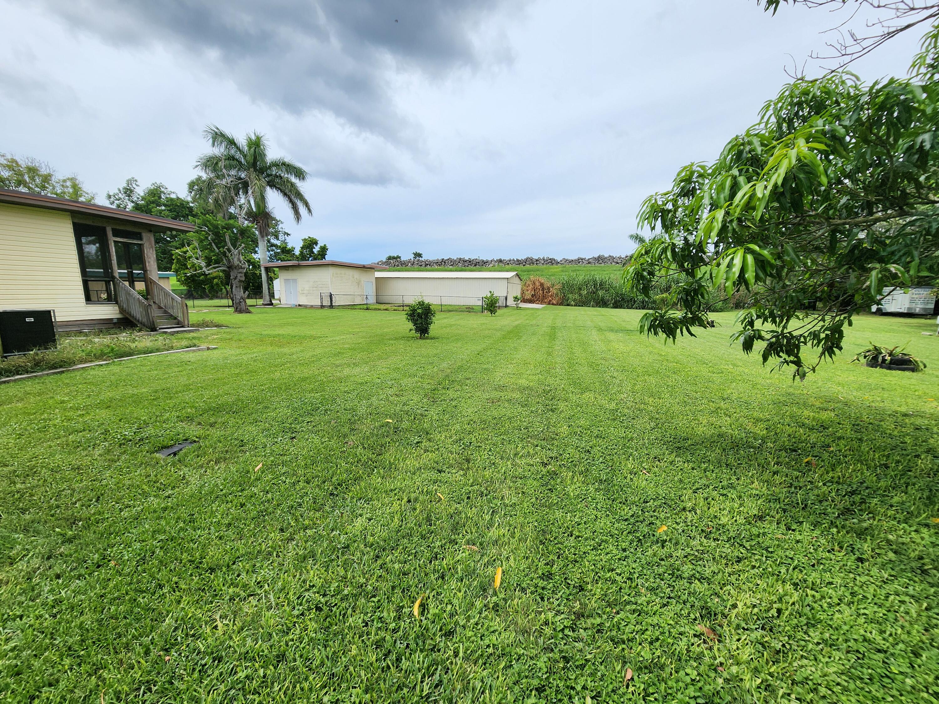 2727 Bacom Point Road Pahokee, FL 33476 - Photo 12 of 34 a view of backyard with house