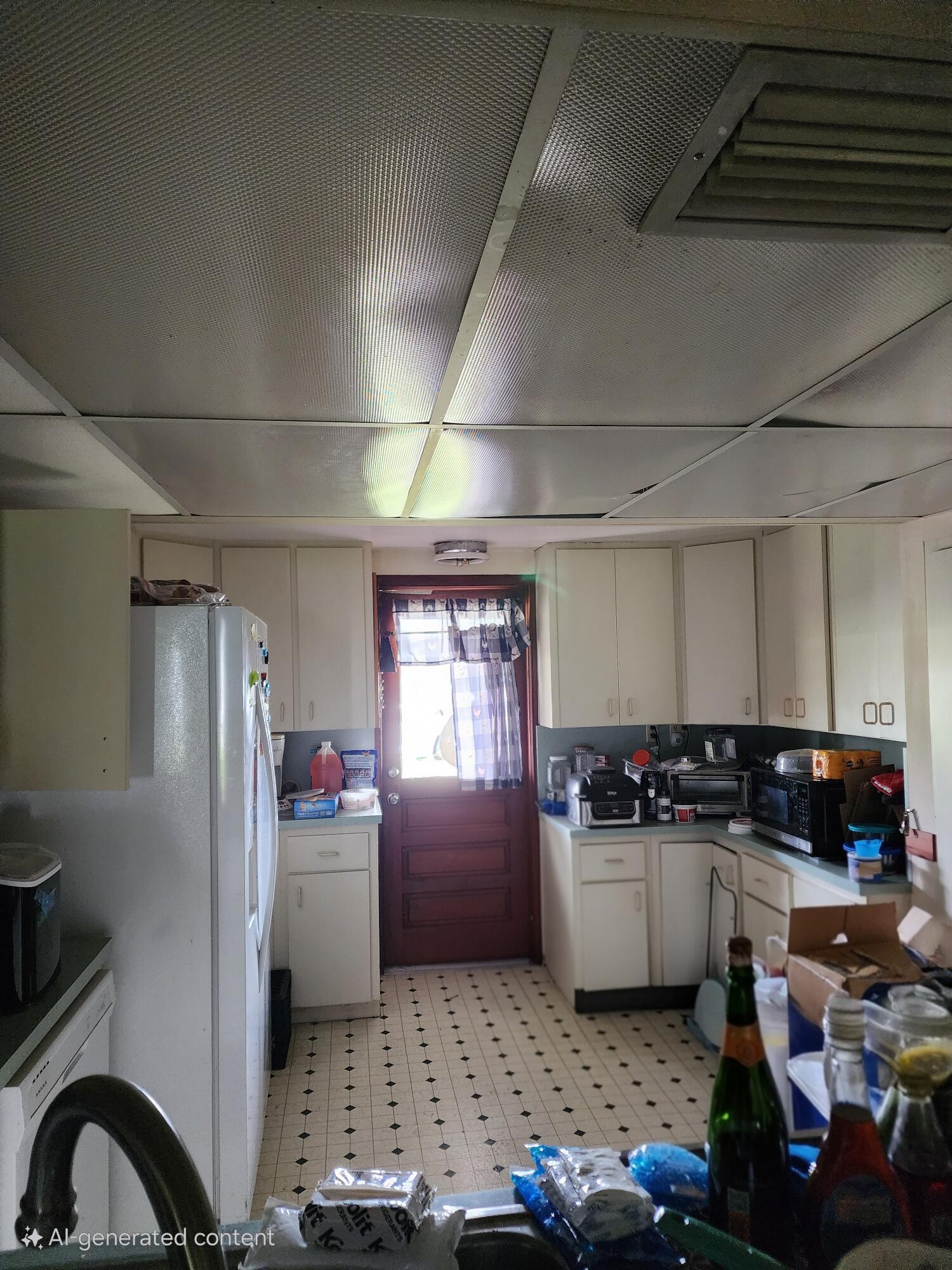 2727 Bacom Point Road Pahokee, FL 33476 - Photo 20 of 34 a kitchen with refrigerator and stove