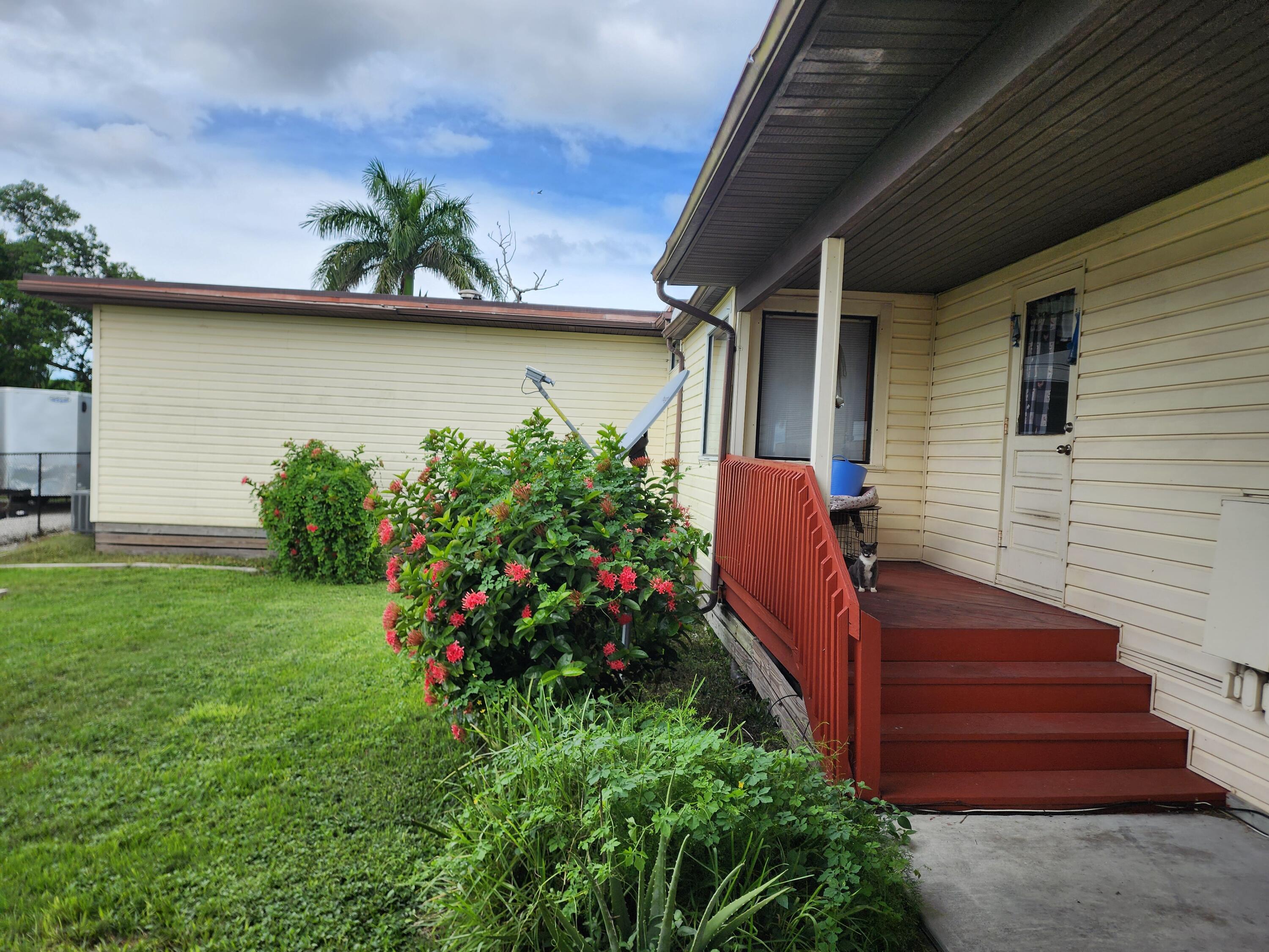 2727 Bacom Point Road Pahokee, FL 33476 - Photo 3 of 34 a view of a backyard with plants