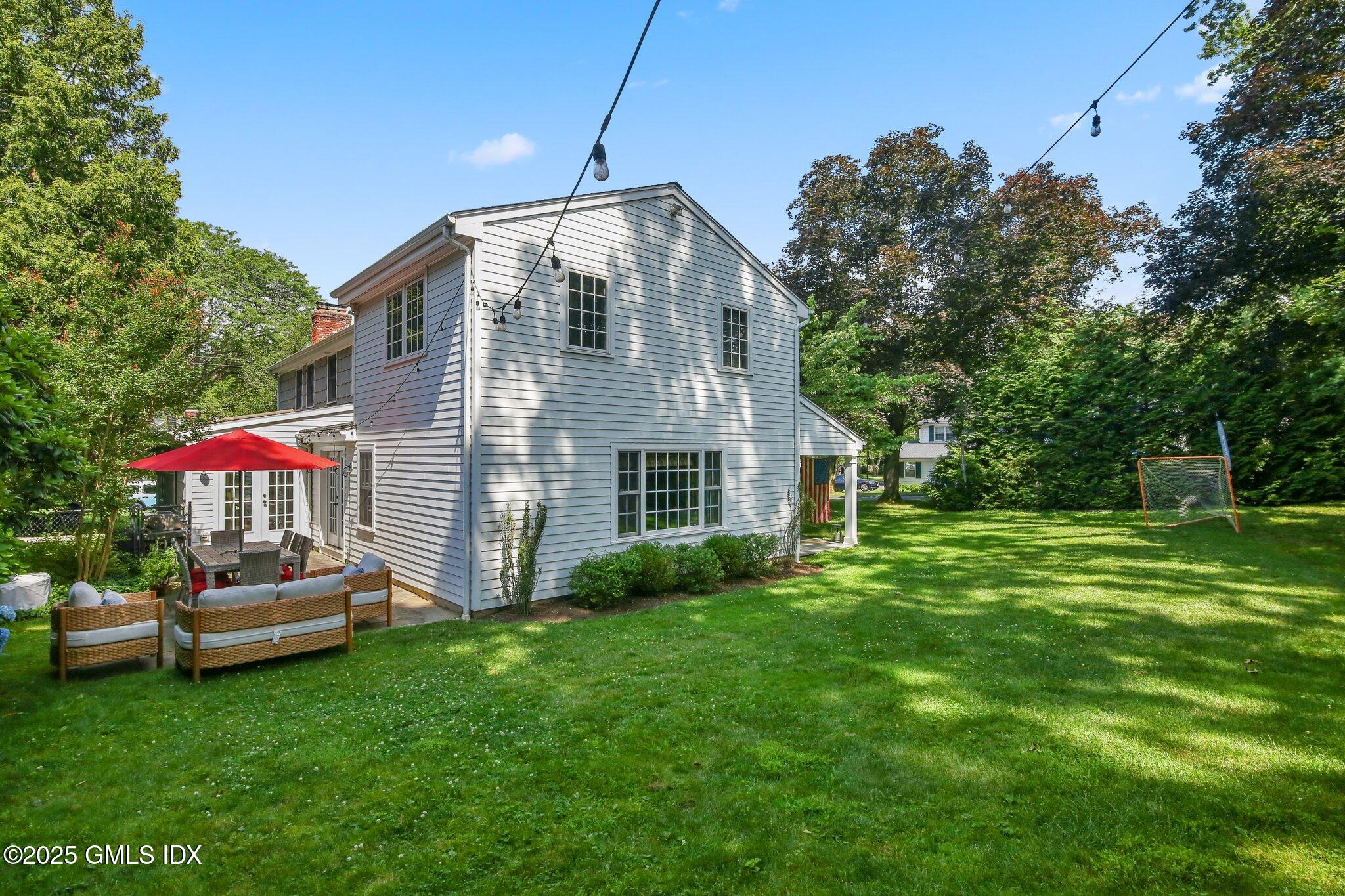 16 Split Timber Place Riverside, CT 06878 - Photo 32 of 34 a front view of house with yard and trees