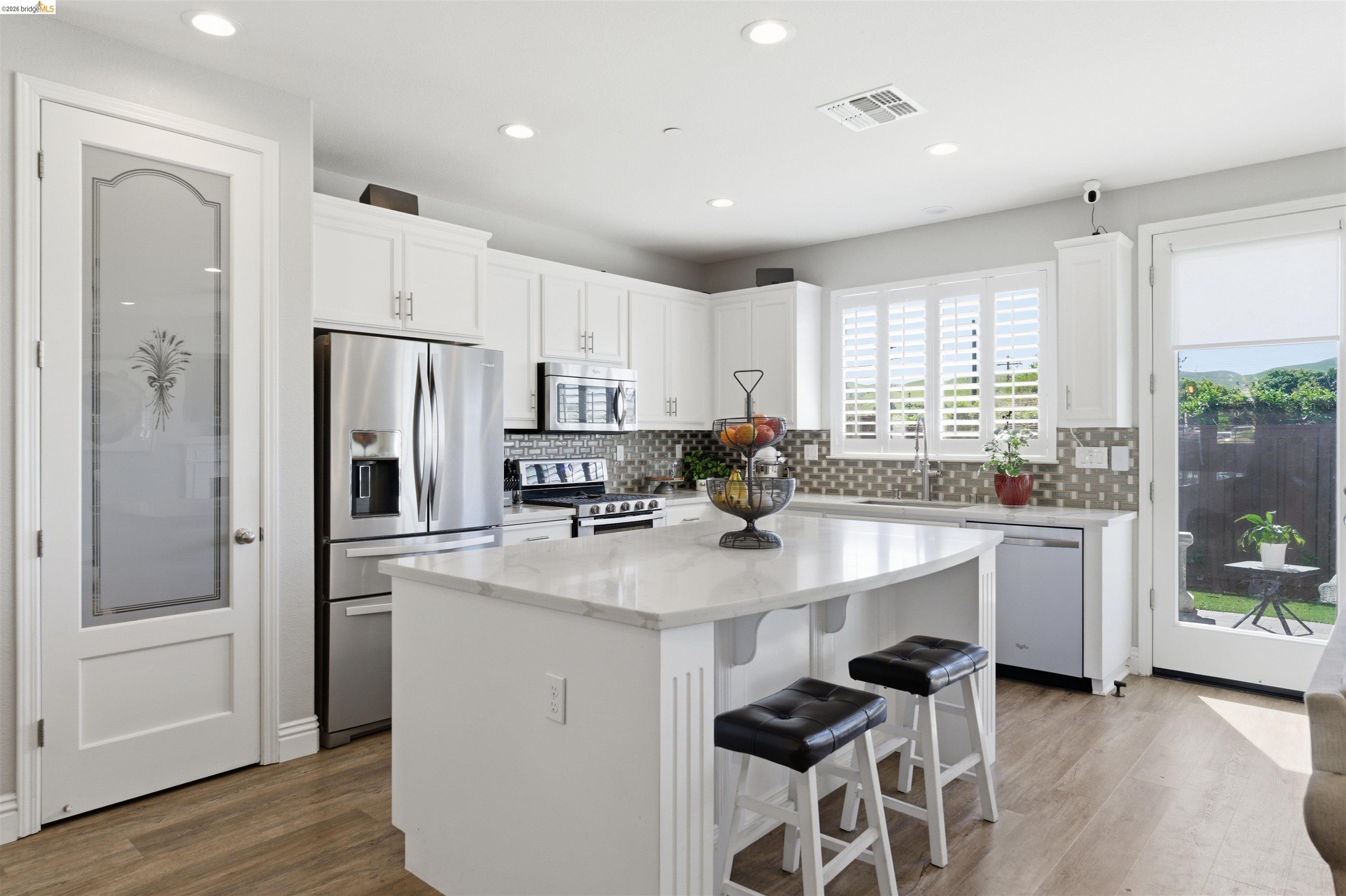 72 Greystone Place Pittsburg, CA 94565 - Photo 11 of 41 a kitchen with stainless steel appliances a sink a stove a refrigerator and cabinets