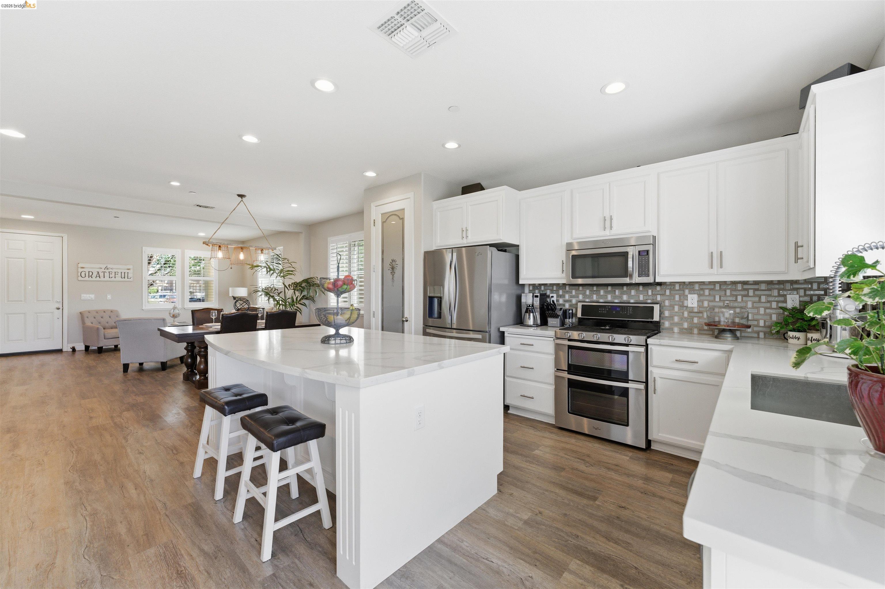 72 Greystone Place Pittsburg, CA 94565 - Photo 12 of 41 a large white kitchen with stainless steel appliances