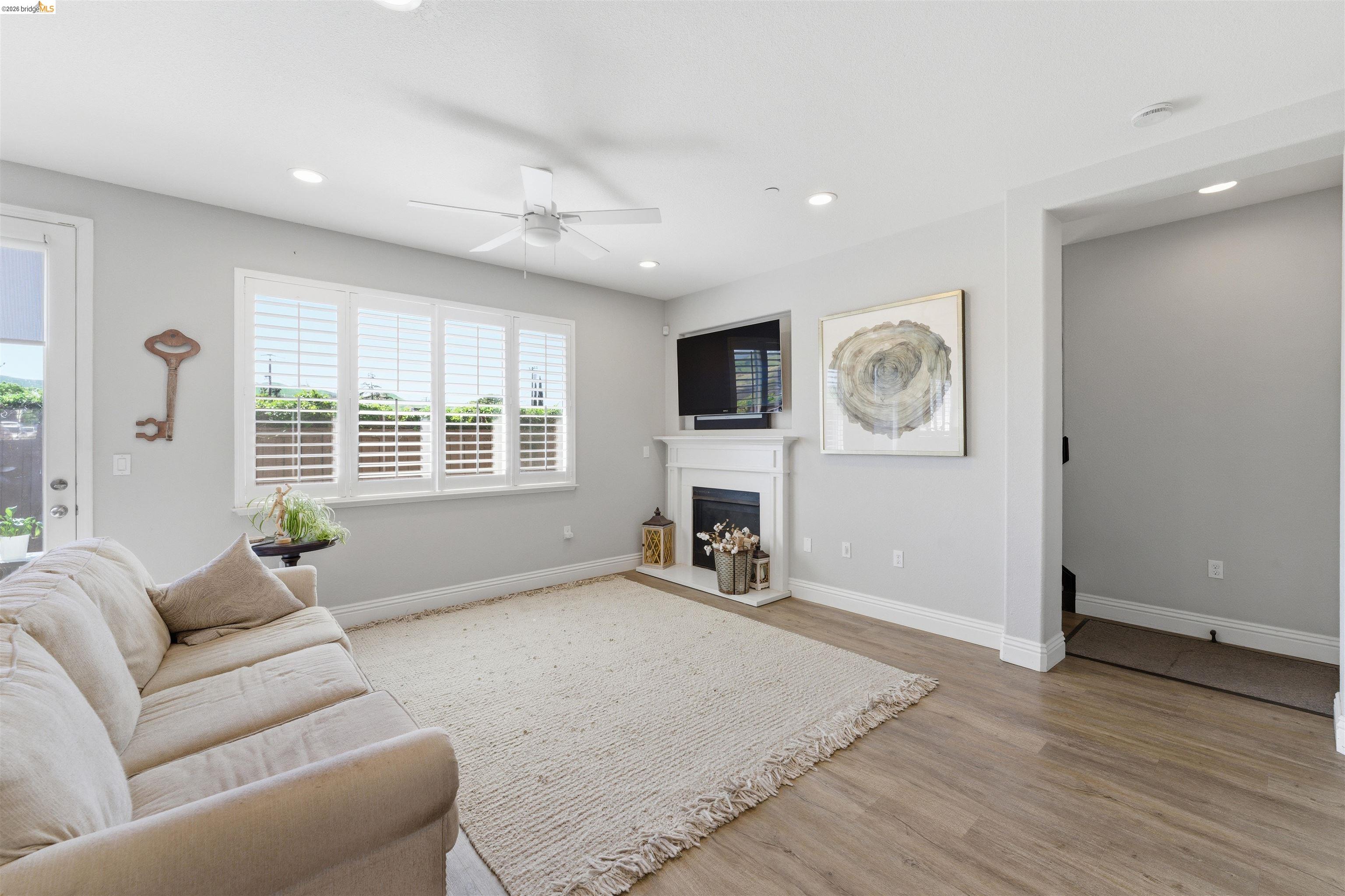 72 Greystone Place Pittsburg, CA 94565 - Photo 16 of 41 a living room with furniture and a fireplace