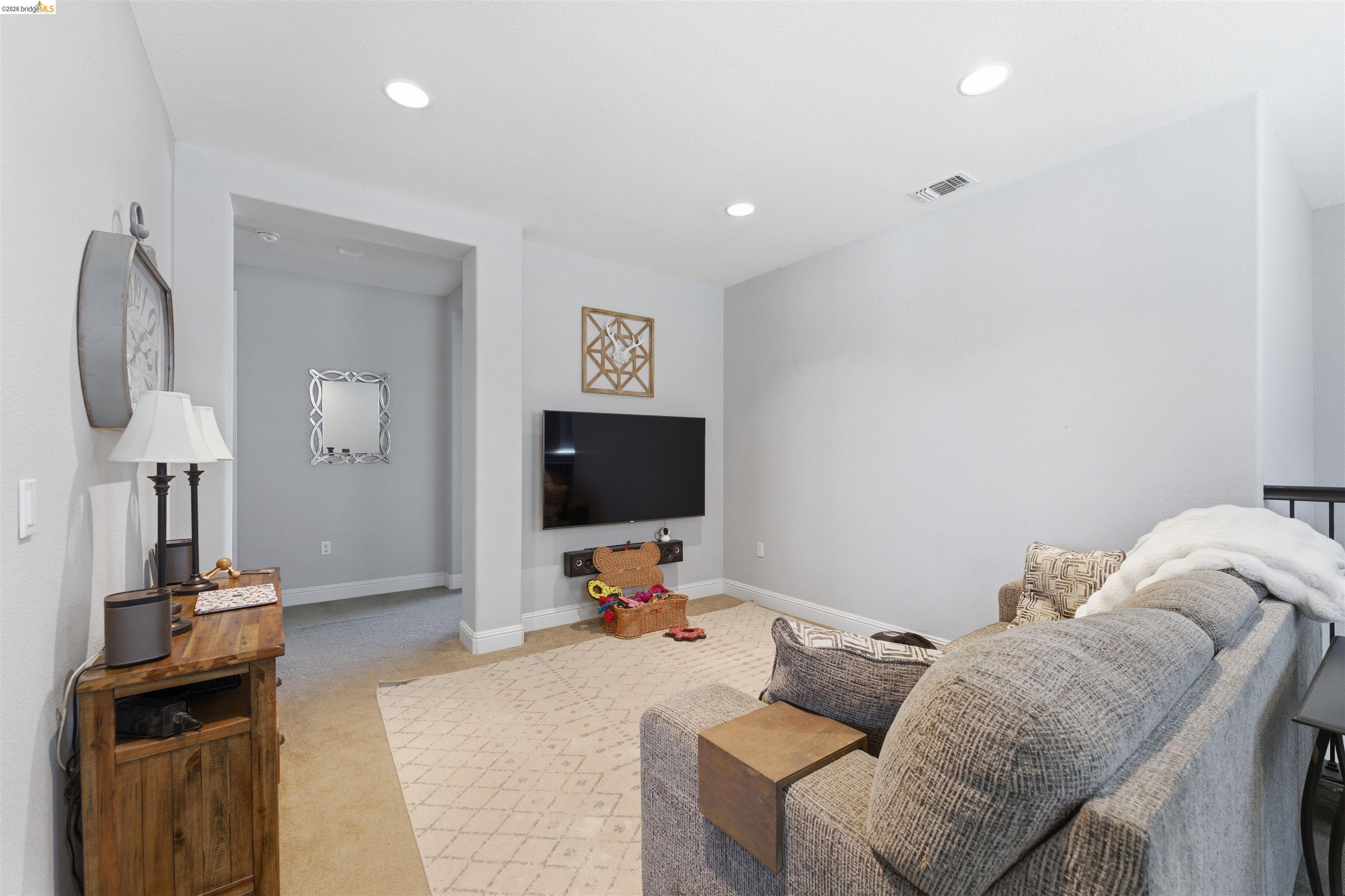 72 Greystone Place Pittsburg, CA 94565 - Photo 20 of 41 a living room with furniture and a flat screen tv