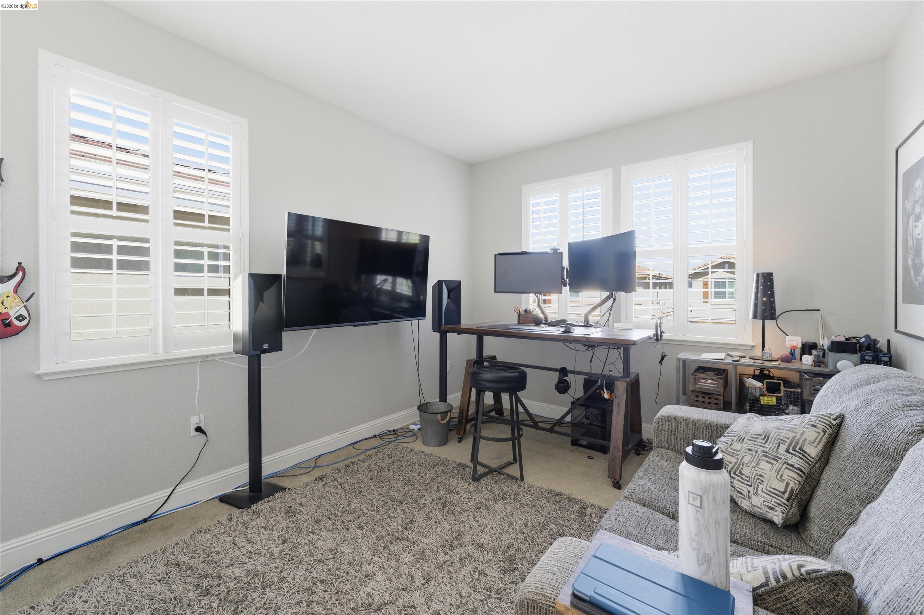 72 Greystone Place Pittsburg, CA 94565 - Photo 21 of 41 a living room with furniture a flat screen tv and a window