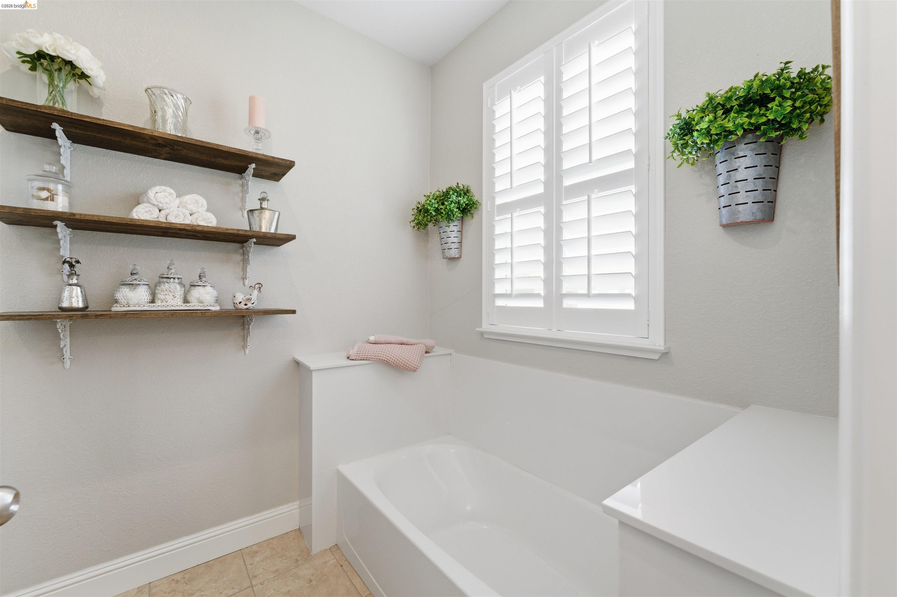 72 Greystone Place Pittsburg, CA 94565 - Photo 27 of 41 a white bath tub sitting in a bathroom next to a window