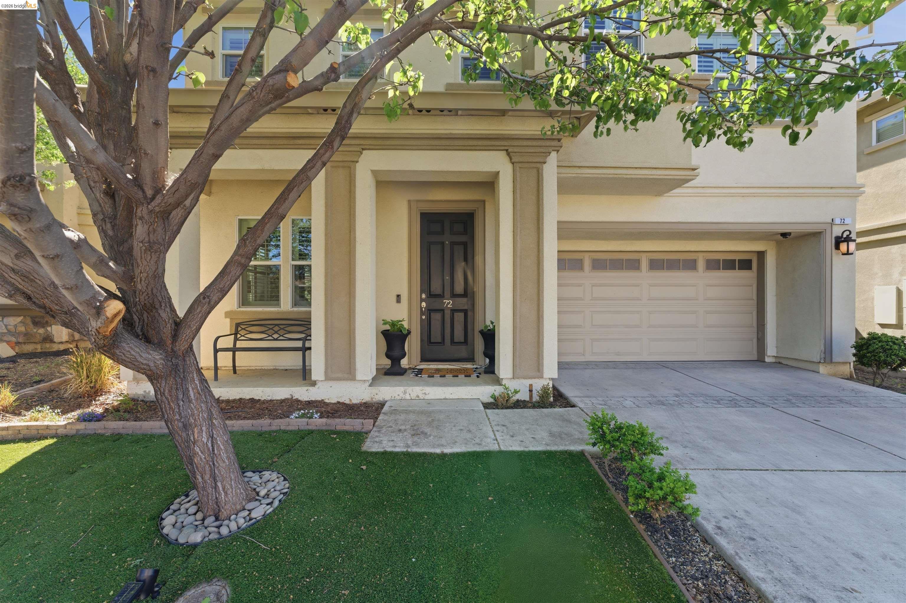 72 Greystone Place Pittsburg, CA 94565 - Photo 3 of 41 a front view of a house with a yard