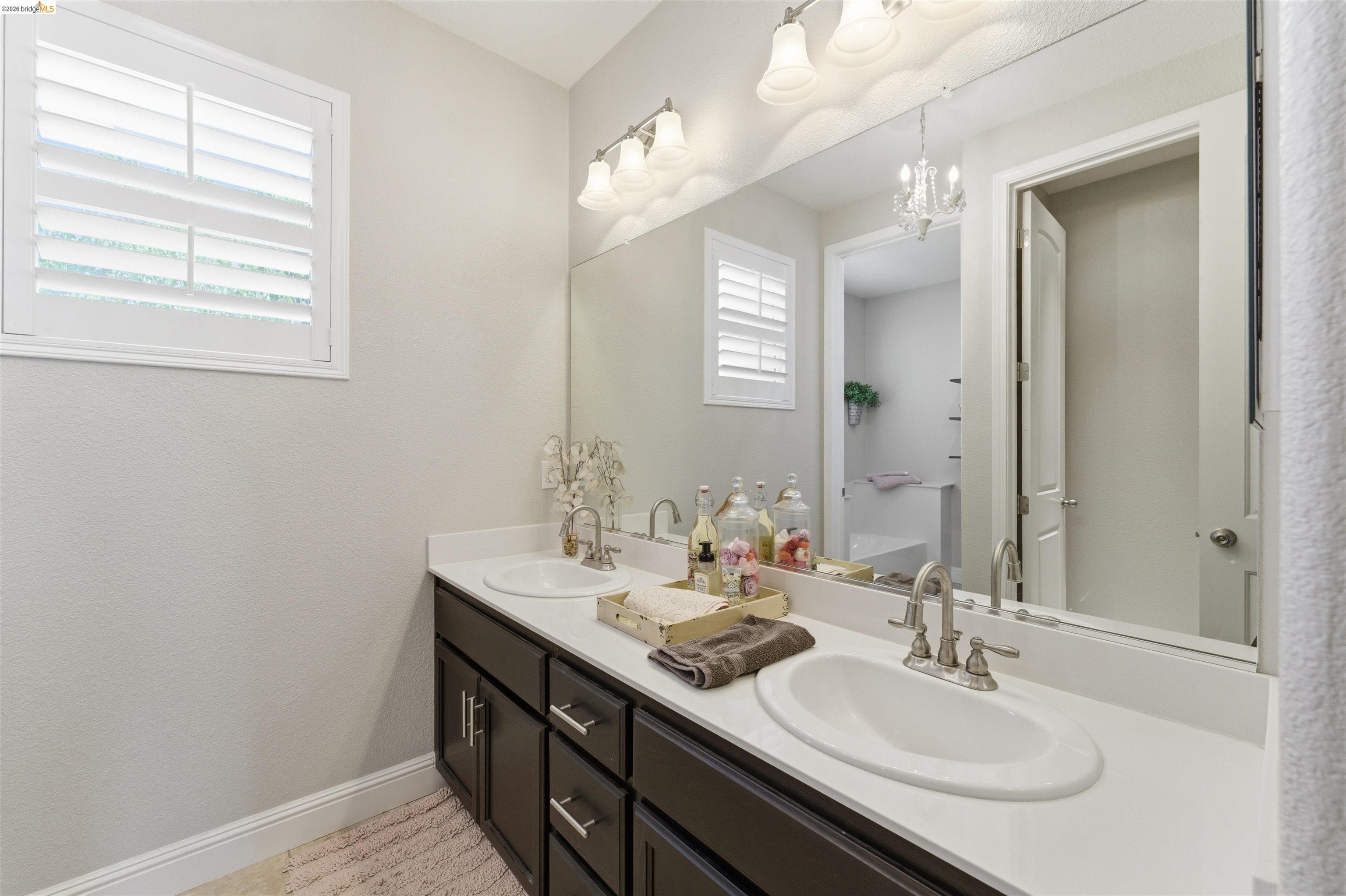 72 Greystone Place Pittsburg, CA 94565 - Photo 29 of 41 a bathroom with a sink double vanity and a mirror