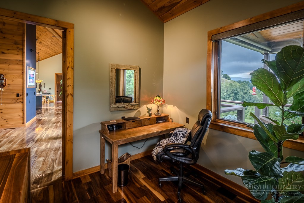 179 Adams Road Vilas, NC 28692 - Photo 17 of 50 a view of a workspace with furniture