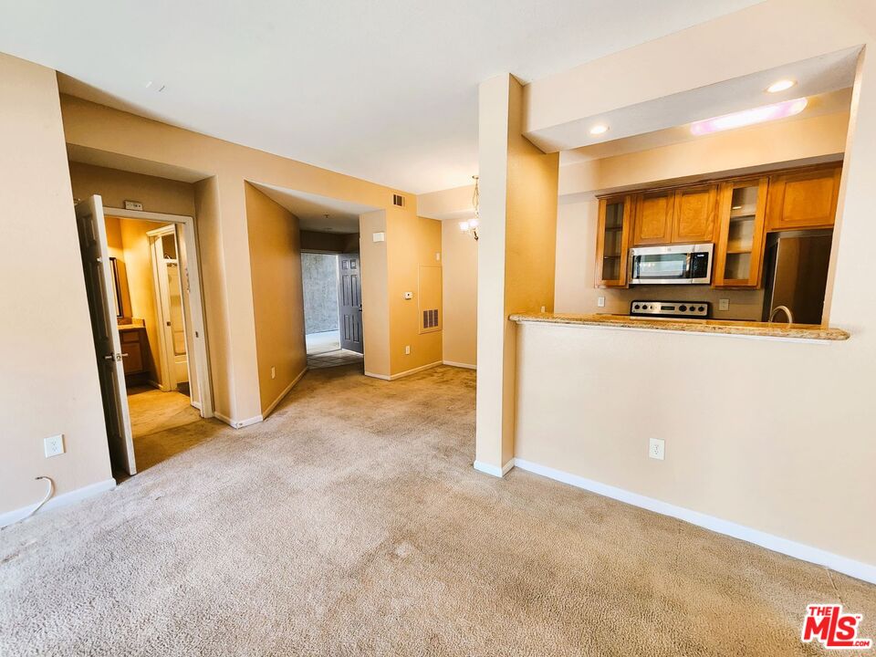 375 Central Avenue, Unit 165 Riverside, CA 92507 - Photo 1 of 24 a view of a hallway with wooden floor