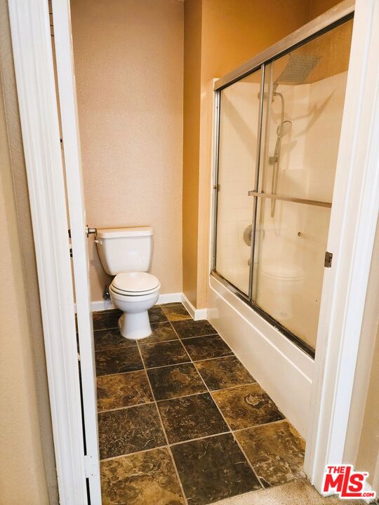 375 Central Avenue, Unit 165 Riverside, CA 92507 - Photo 17 of 24 a bathroom with a toilet and a shower