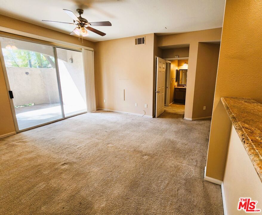 375 Central Avenue, Unit 165 Riverside, CA 92507 - Photo 3 of 24 a view of empty room with window and ceiling fan
