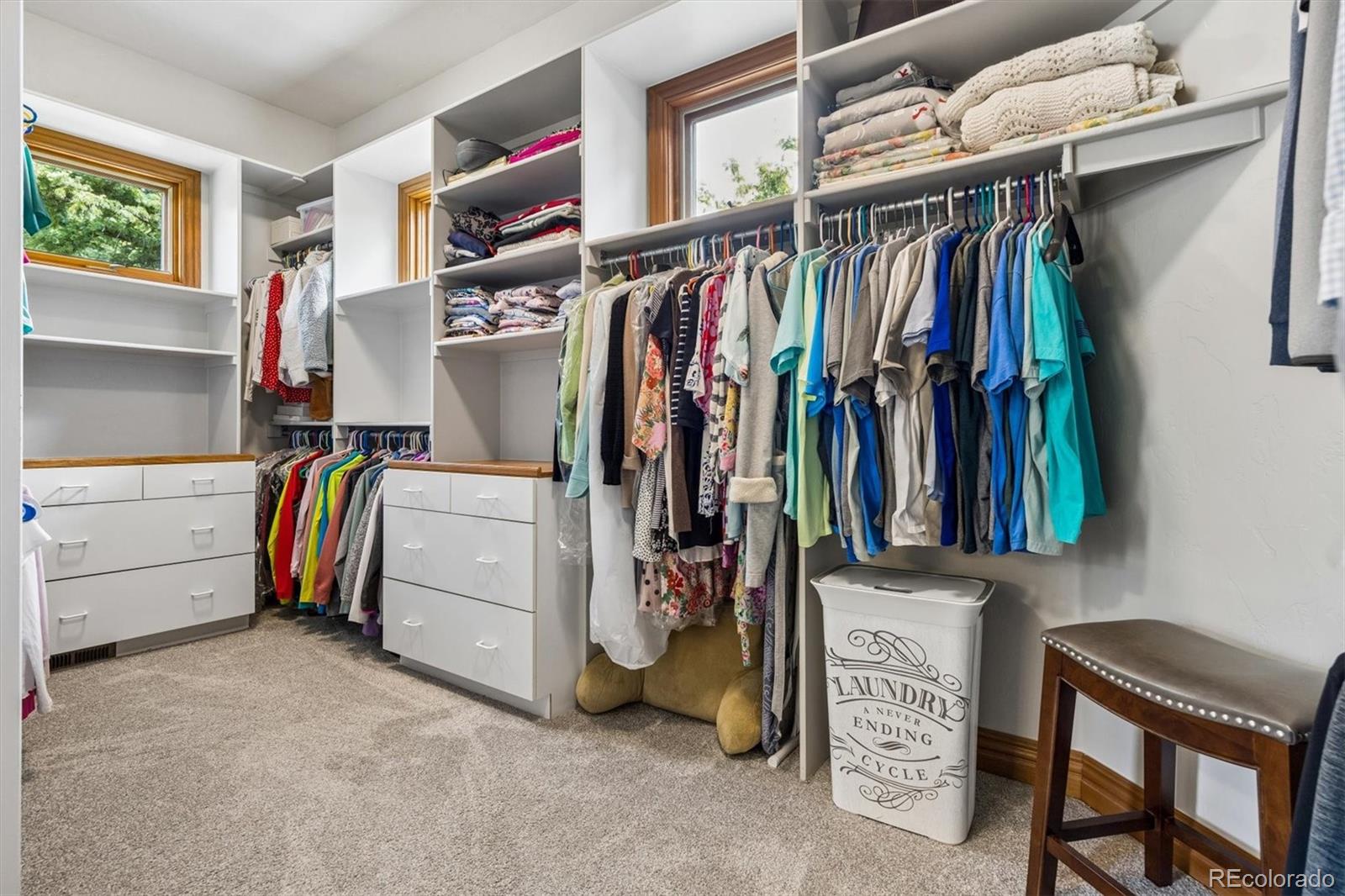 16422 Rocky Point Lane Morrison, CO 80465 - Photo 25 of 50 a view of walk in closet with clothes and shoes