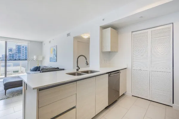 a kitchen with a sink and cabinets