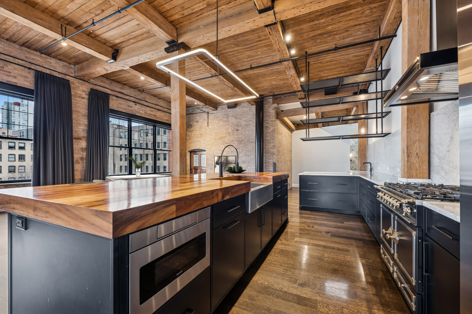 1000 West Washington Boulevard, Unit 436437 Chicago, IL 60607 - Photo 14 of 42 a kitchen with stainless steel appliances granite countertop a stove and a sink
