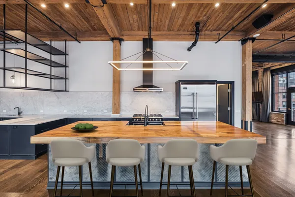 a dining table with chairs and window