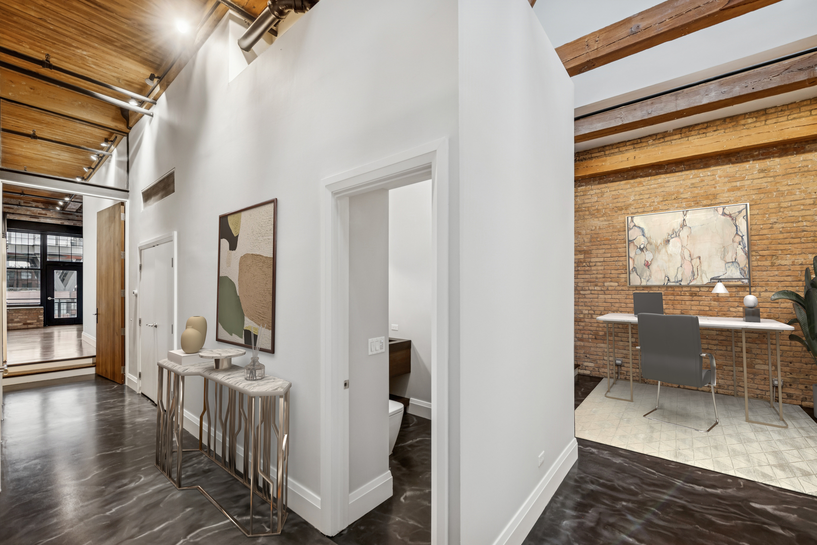 1000 West Washington Boulevard, Unit 436437 Chicago, IL 60607 - Photo 22 of 42 a view of a hallway with living room and wooden floor