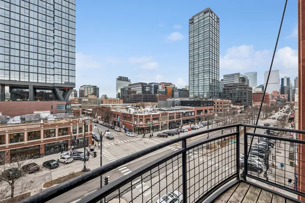 a city view from a balcony with city view
