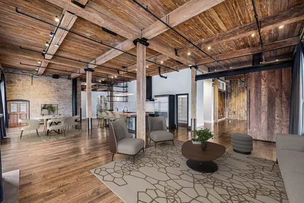 a view of a patio with table and chairs