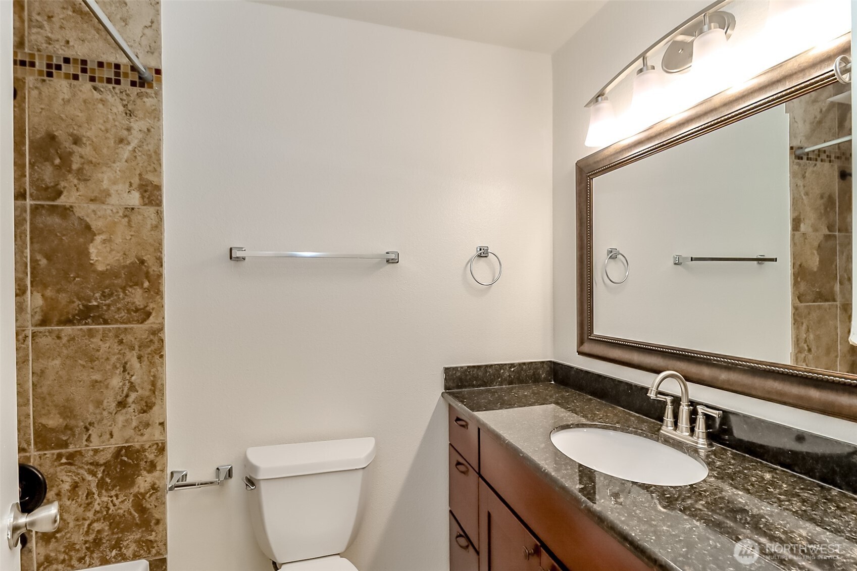 20015 108th Avenue Northeast Bothell, WA 98011 - Photo 17 of 30 a bathroom with a granite countertop sink toilet a mirror and shower
