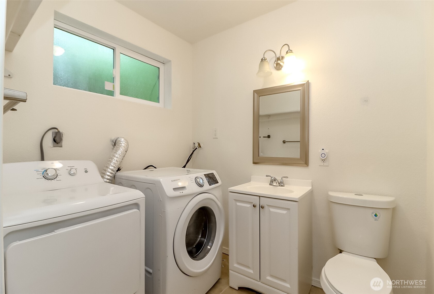 20015 108th Avenue Northeast Bothell, WA 98011 - Photo 18 of 30 a bathroom with a sink and a washer dryer
