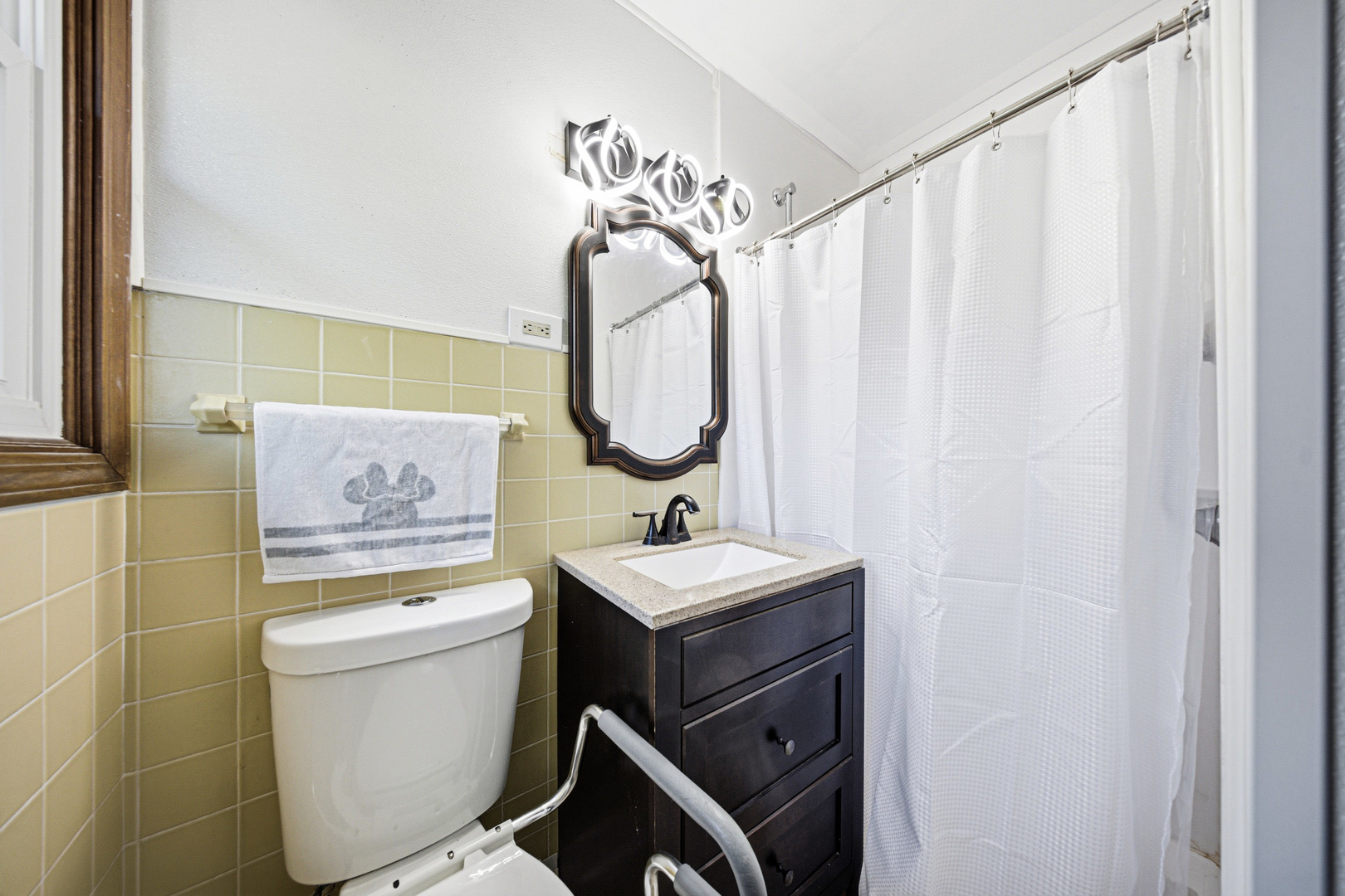 491 Maple Avenue Carpentersville, IL 60110 - Photo 17 of 33 a bathroom with a toilet sink vanity and mirror