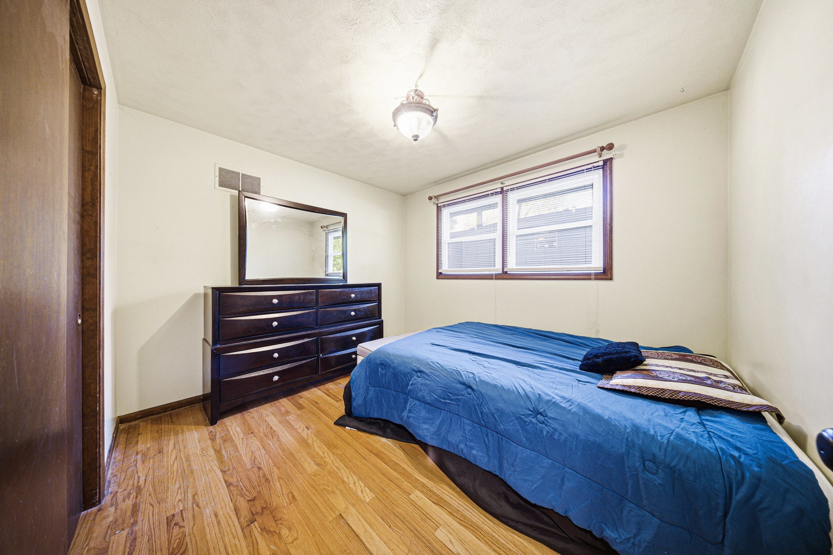491 Maple Avenue Carpentersville, IL 60110 - Photo 19 of 33 a bedroom with a bed and a dresser