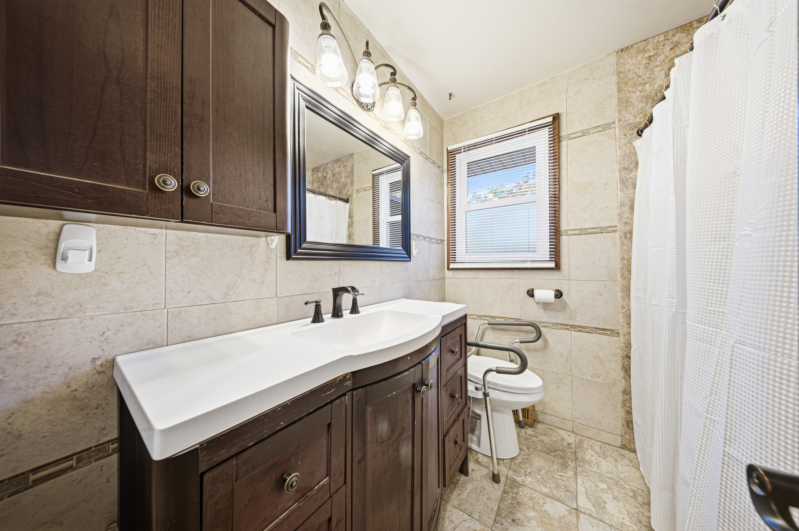 491 Maple Avenue Carpentersville, IL 60110 - Photo 20 of 33 a bathroom with a sink a toilet and mirror