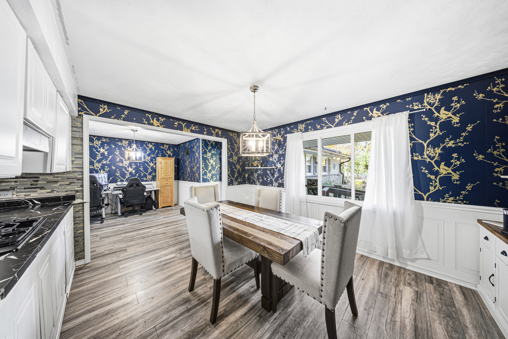 491 Maple Avenue Carpentersville, IL 60110 - Photo 4 of 33 a view of a dining room with furniture window and wooden floor