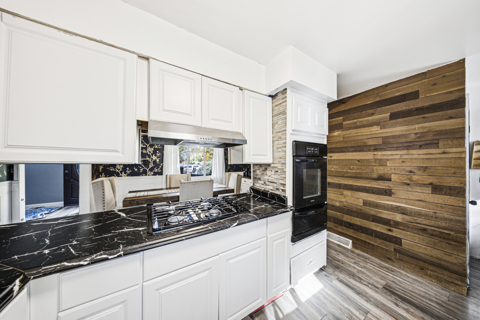 491 Maple Avenue Carpentersville, IL 60110 - Photo 6 of 33 a kitchen with stainless steel appliances granite countertop a sink and a stove