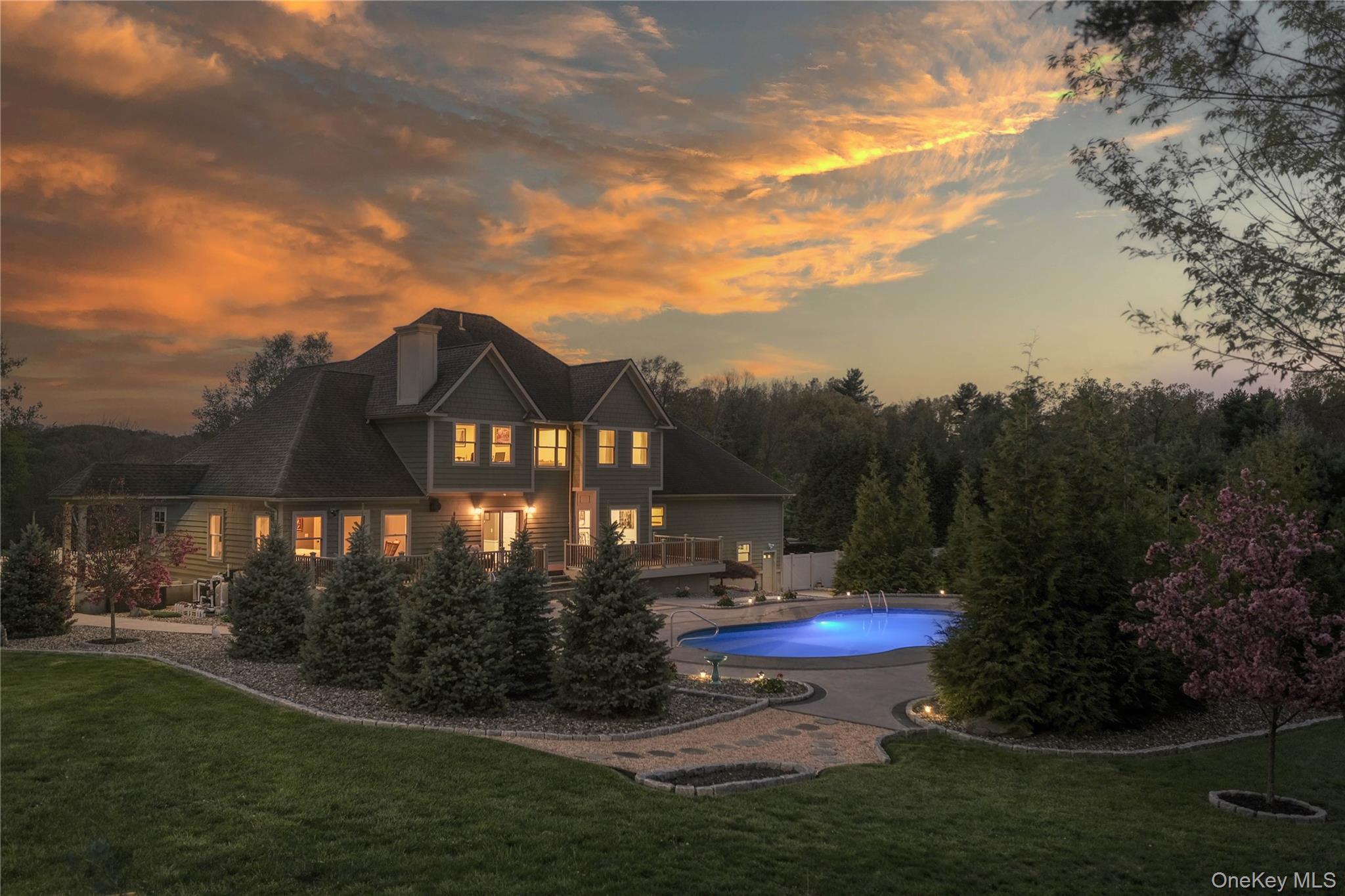 163 Hapeman Hill Road Red Hook, NY 12571 - Photo 1 of 50 A backyard daydream, where a pristine pool and playful pops of luxury invite you to dive right in.