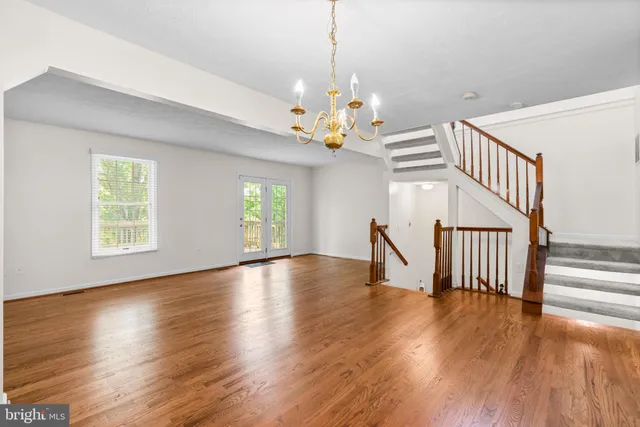 a view of an entryway with wooden floor