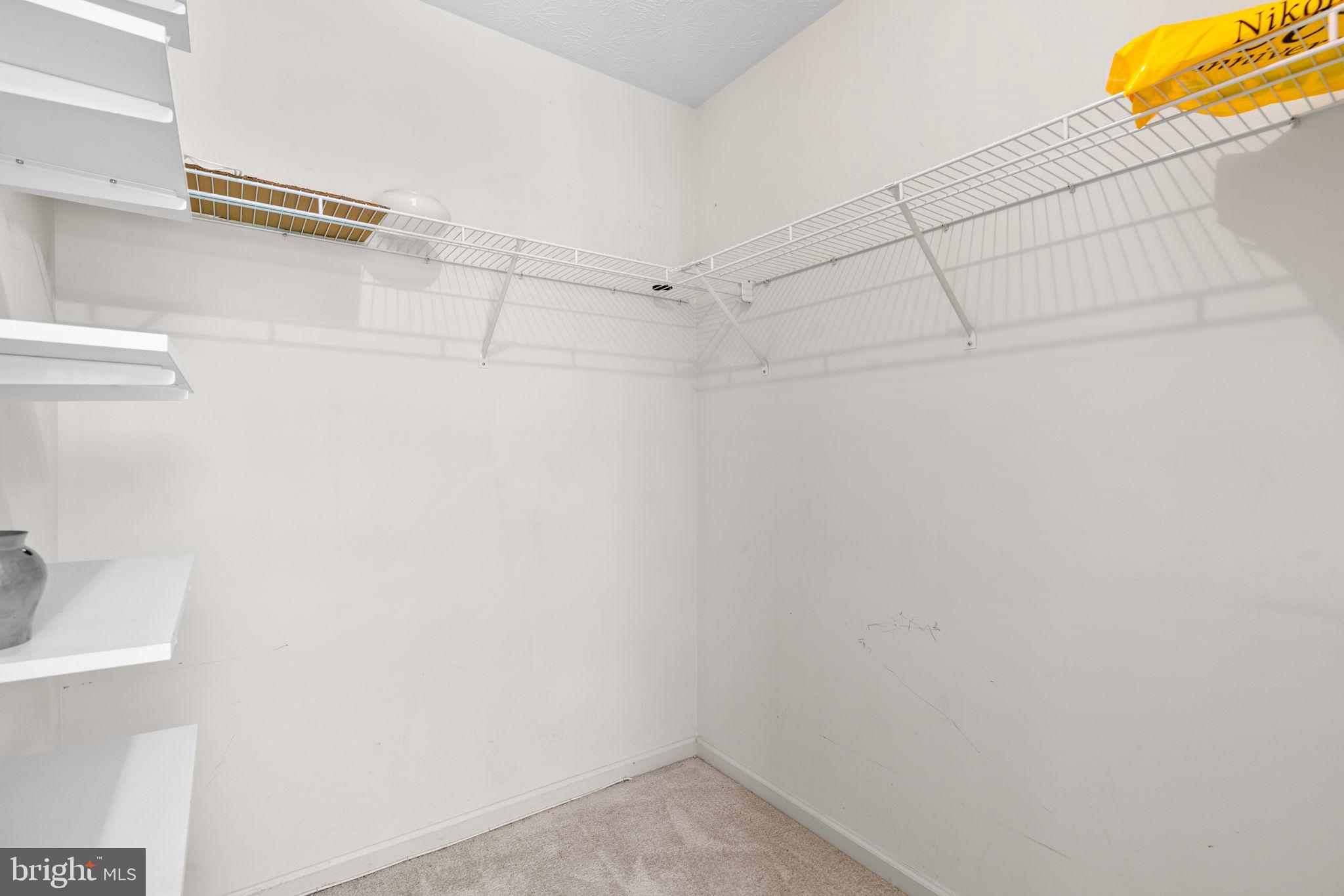 5646 April Journey, Unit 50 Columbia, MD 21044 - Photo 19 of 32 a view of a room with racks on the wall