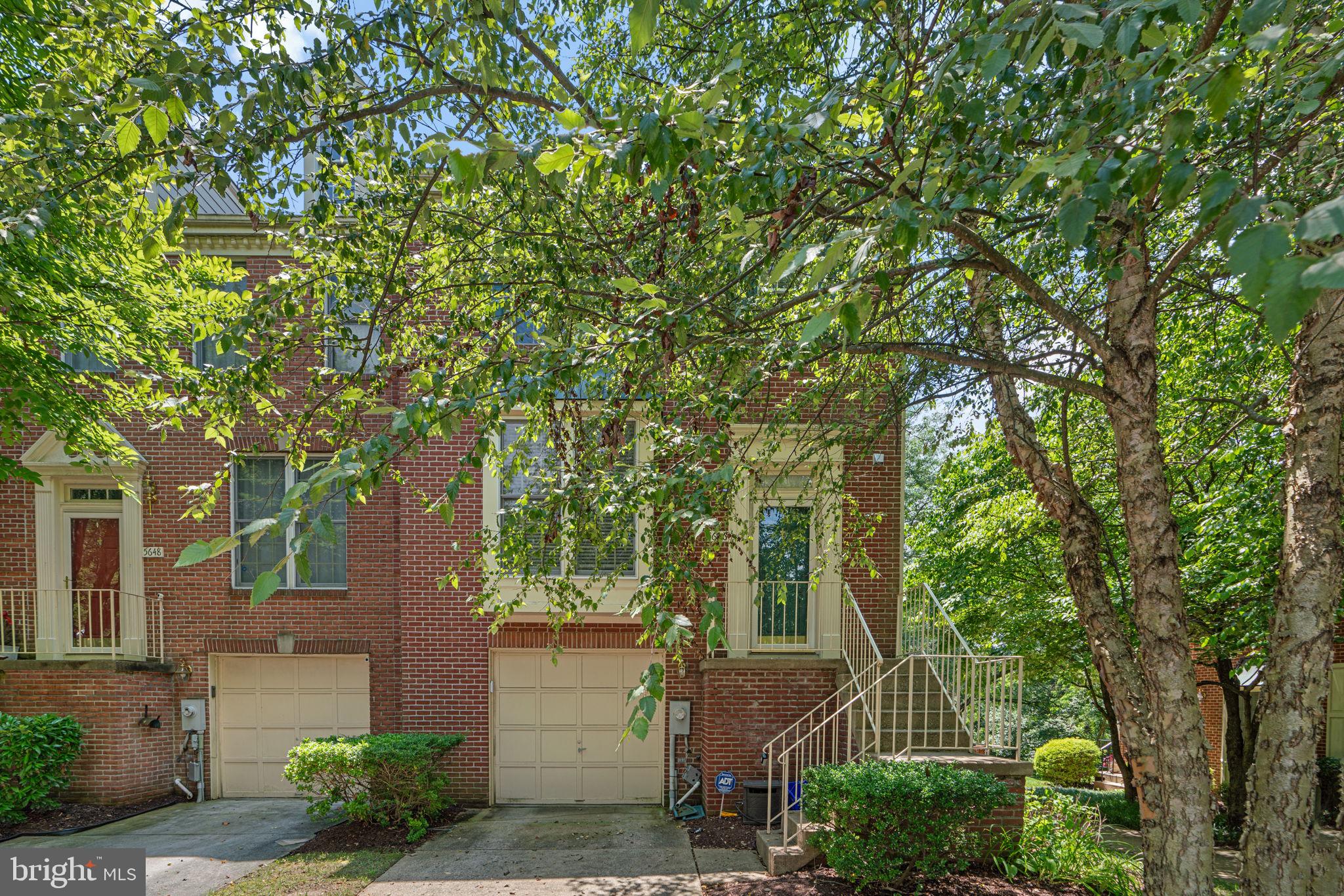 5646 April Journey, Unit 50 Columbia, MD 21044 - Photo 2 of 32 front view of a house with a tree