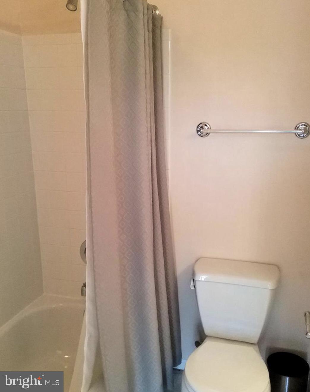 5646 April Journey, Unit 50 Columbia, MD 21044 - Photo 23 of 32 a white toilet sitting next to a bath tub